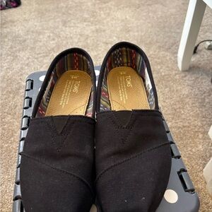 Toms Black Canvas Slip-On Loafers with Patterned Lining